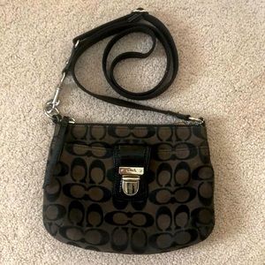 Coach black cross-body purse.